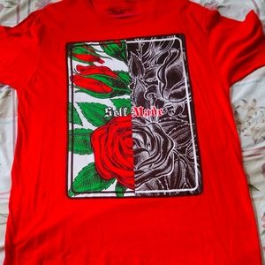 A red, rose designed tee entitled "self-made" on the front